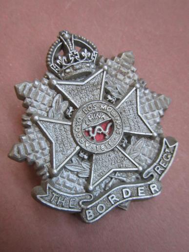 A attractive - and now days not so easy to find - plastic i.e bakelite The Border Regiment cap badge