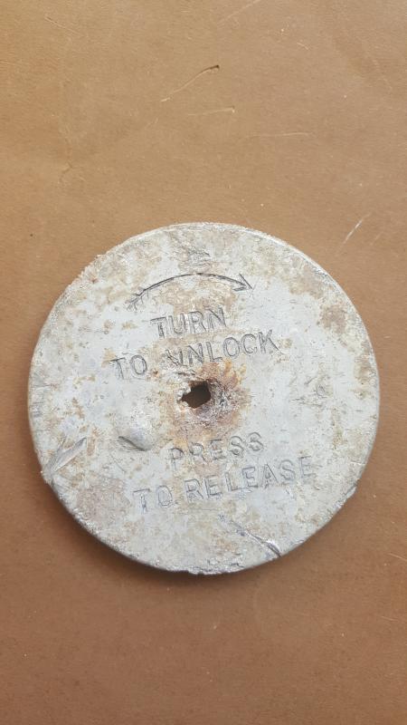 A orginal Arnhem battle ground dug up press release plate for a X type parachute clock