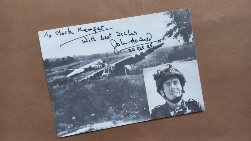 A by Major John Howard, Oxfordshire and Buckinghamshire Light Infantry signed Pegasus Bridge Cafe postcard