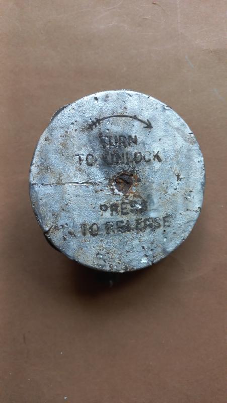 A orginal Arnhem battle ground dug up press release plate for a X type parachute clock