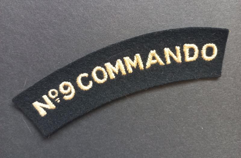 A superb - albeit regrettably single - typical British made (with a glue ie paste backing) Number 9 Commando shoulder title