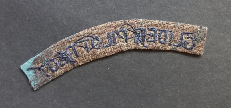 A superb example of a embroided un-issued Glider Pilot Regiment shoulder title