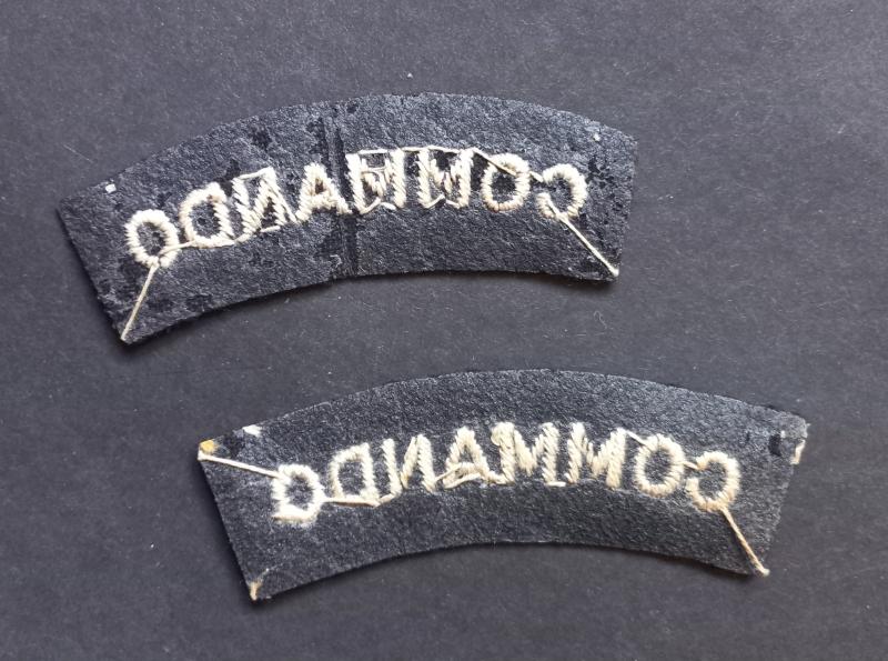 A neat example of a - full matching set -  mid war period so called 'block type' lettering Commando white on black shoulder titles