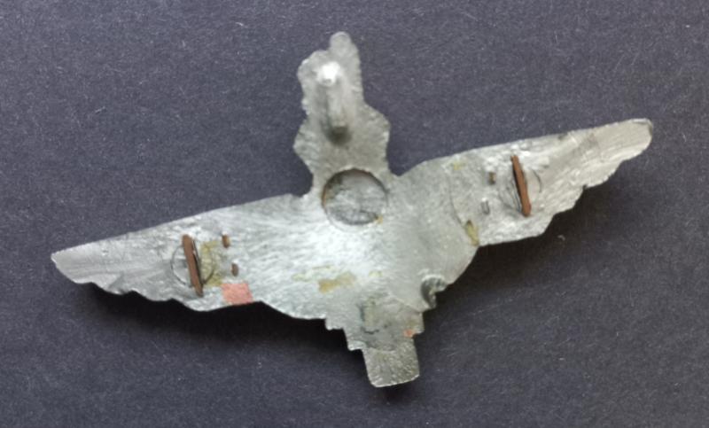 A good (unfortunately missing its two brass blade fittings) example of a plastic cap badge to The Parachute Regiment