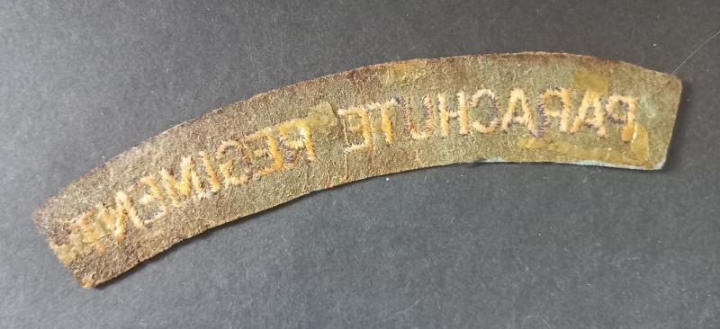 A nice - regrettably single - un-issuesd so called paste back i.e glue back embroided Parachute Regiment shoulder title