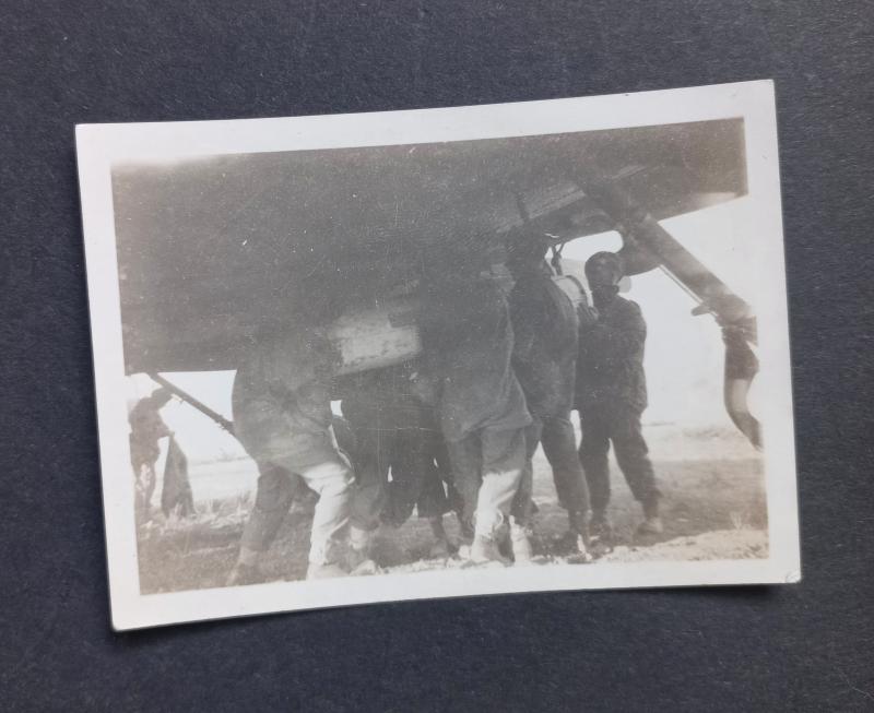 A original and - regrettably small 8.6cm by 6.3cm - period made black and white photograph dispicting men of a Airborne unit loading containers