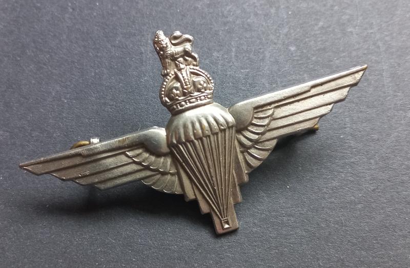A attractive  - standard wartime issued - capbadge to the Parachute Regiment
