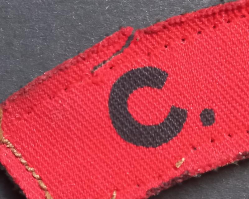 A attractive (unfortnately damage) printed C.M.P. (Corps of Military Police) shoulder title