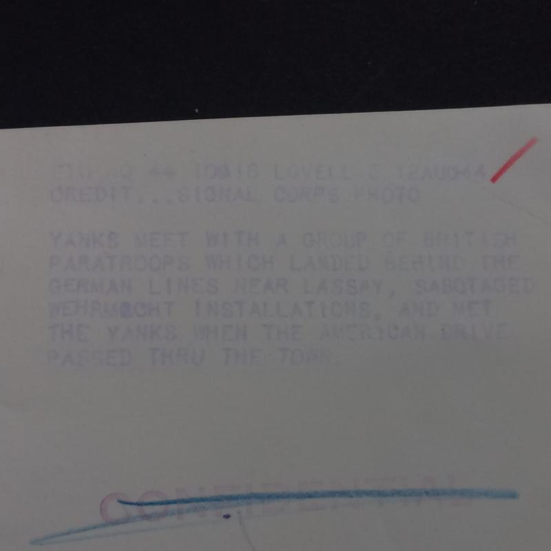 A attractive official US Signal Corps 'Press Release' (large 25.9cm x 20.2cm) photograph showing British S.A.S. (Special Air Service) troops after Operation HAFT meeting up with American troops some were in France