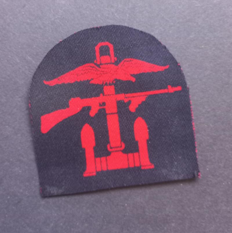 A perfect right facing (regrettably single) printed Combined Operation formation badge