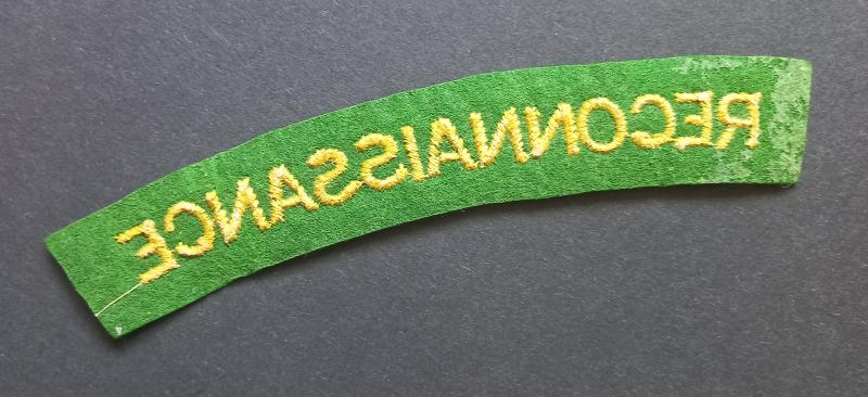 A fine - mid-war period paste backing - un-issued embroided Reconnaissance Corps shoulder title