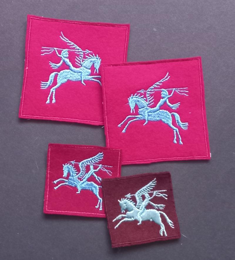 A fine selection of four (post war made) Belgium Pegasus badges