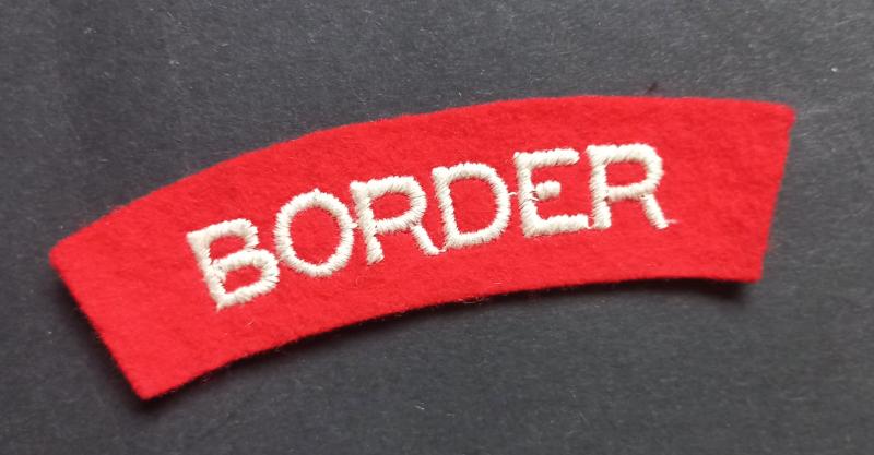 A nice (albeit regrettably single) embroidered Border Regiment shoulder title