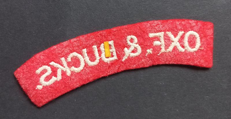 A attractive - albeit regrettably single - issued embroided Oxf.& Bucks. (Oxfordshire and Buckinghamshire Light Infantry) shoulder title